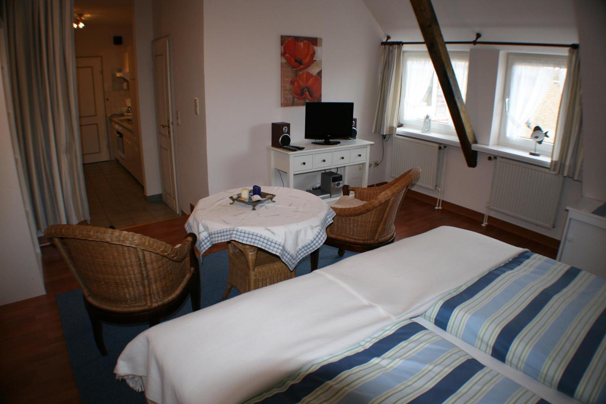 Ferienwohnungen Im Hotel Garni Zur Post Utersum Habitación foto